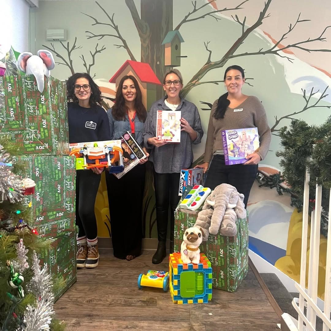 Clinic team members with the toys collected for the holiday drive