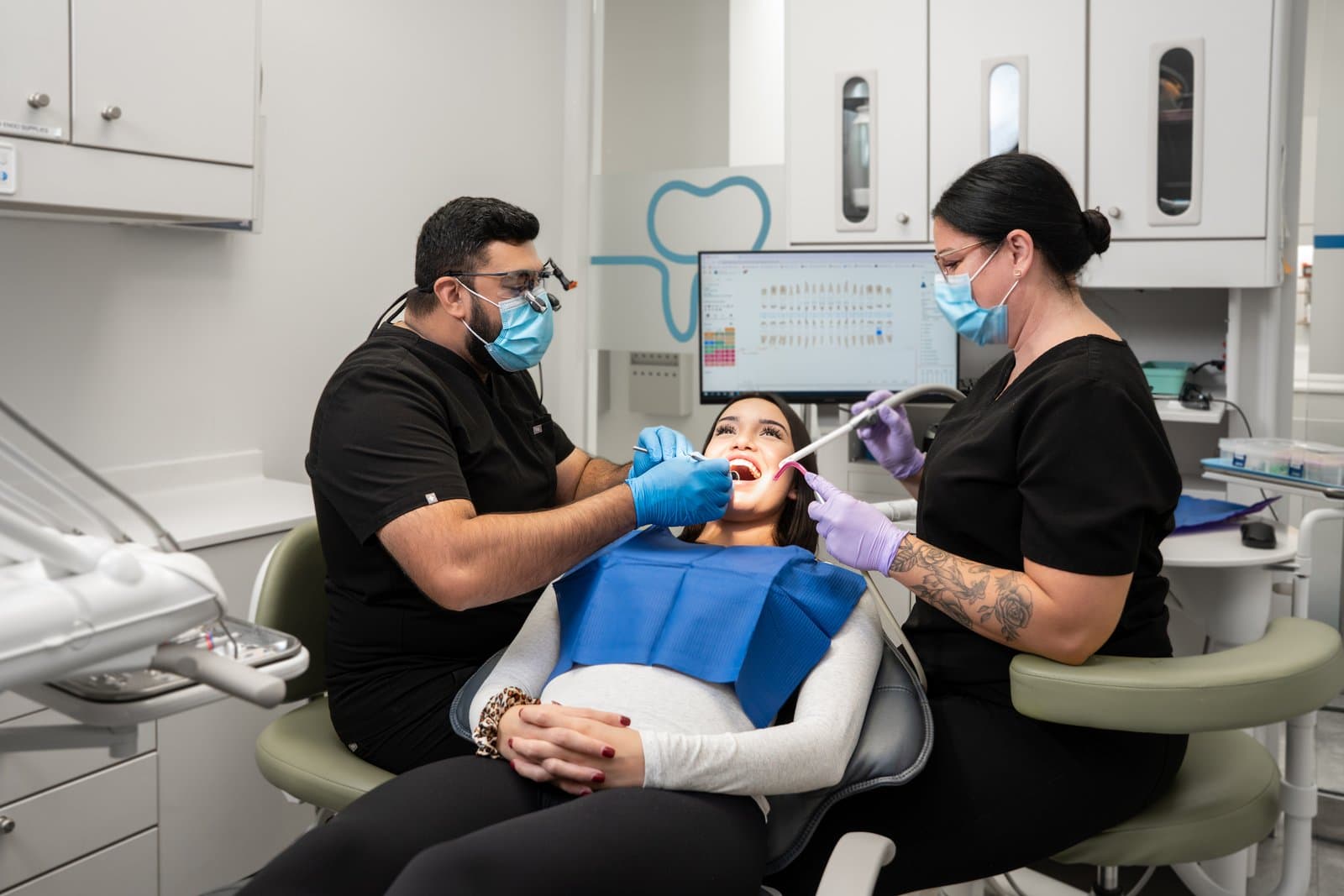 A Dental Choice dentist and assistant treating a patient