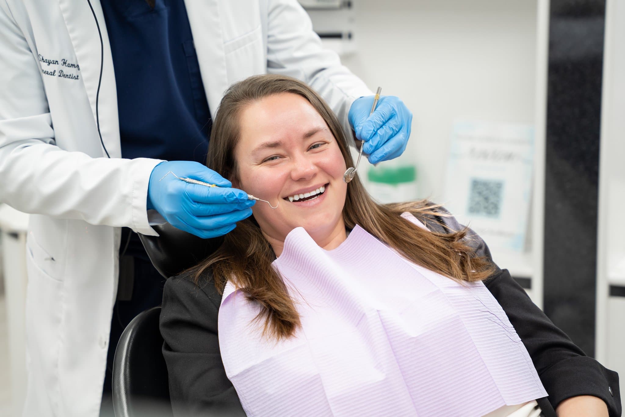 A Dental Choice dentist examining a smiling patient